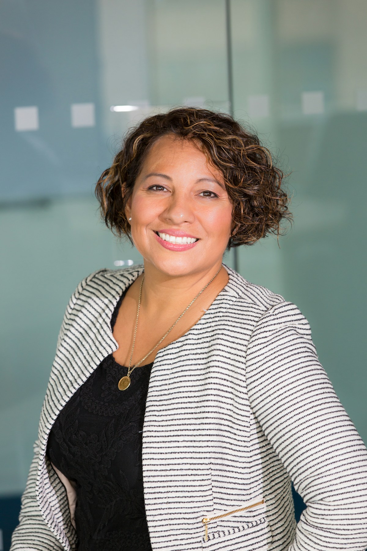 Earn track facilitator reviewing AI workflow materials at desk