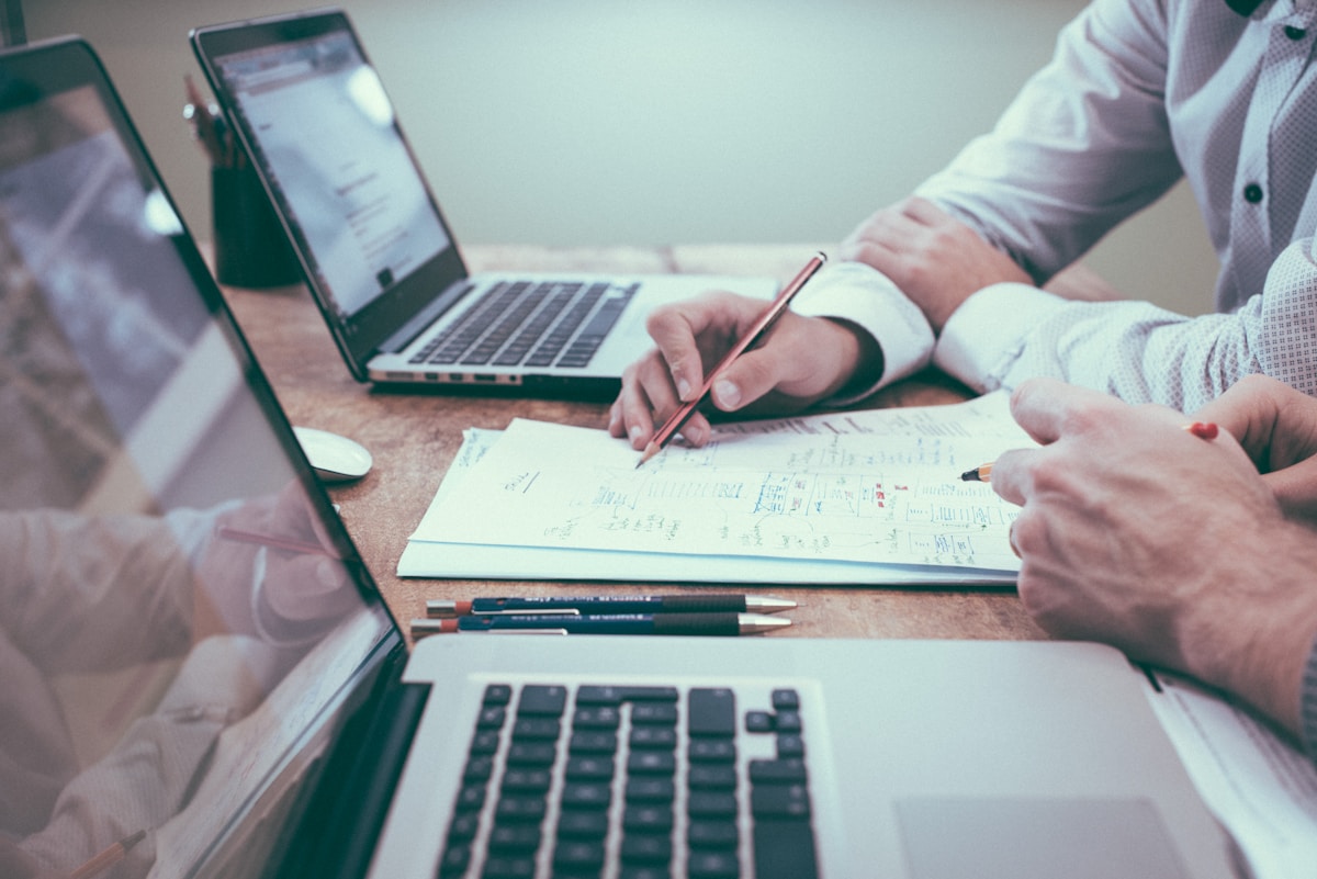 Learner planning earn track goals in notebook during AI productivity session
